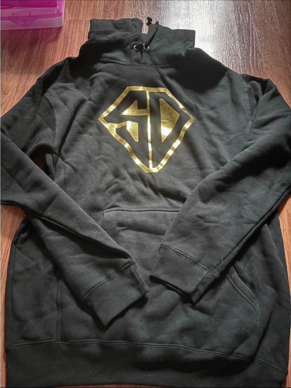 Men's Black Pullover Hoodie with Metallic Gold Emblem